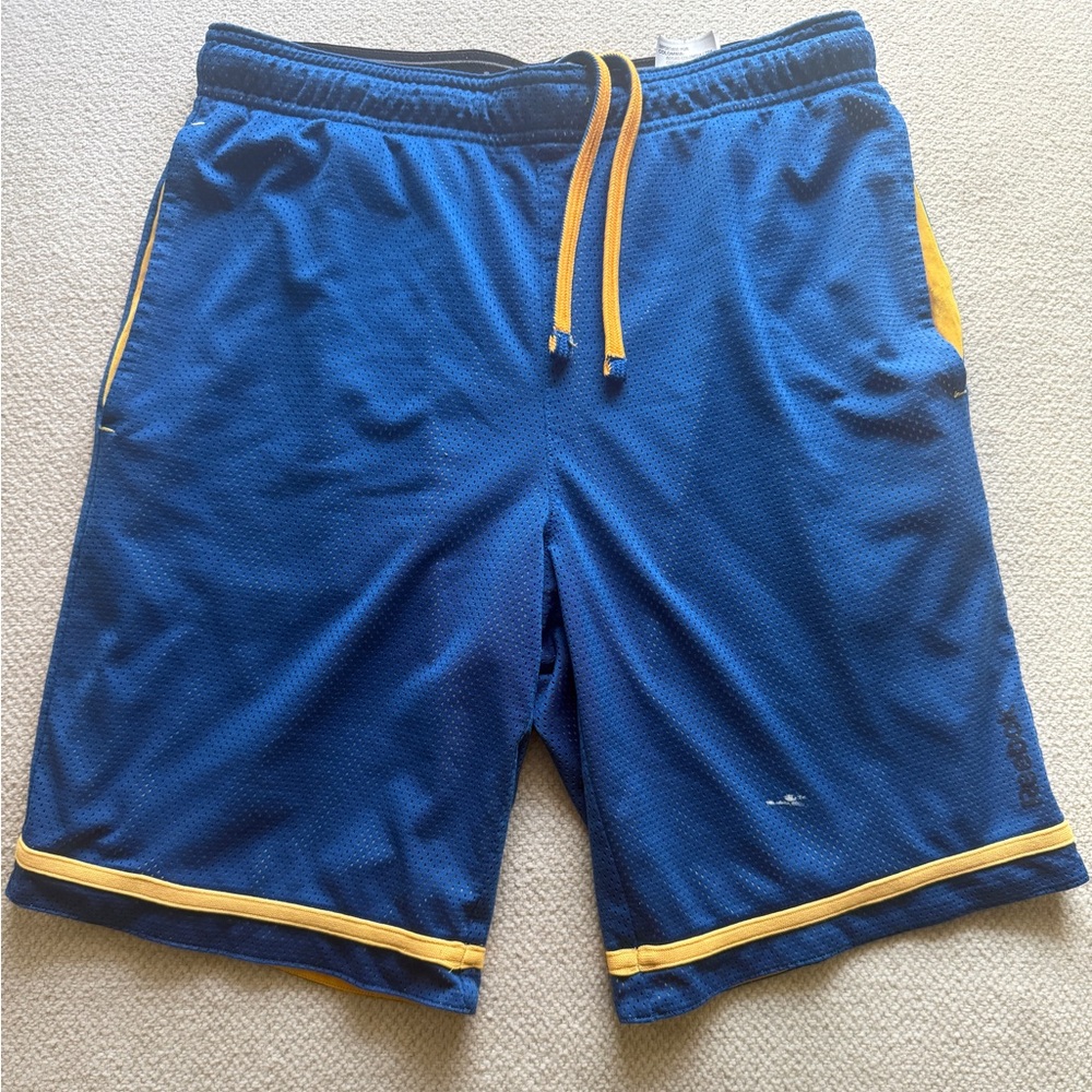 Reebok blue mesh athletic shorts with yellow trim